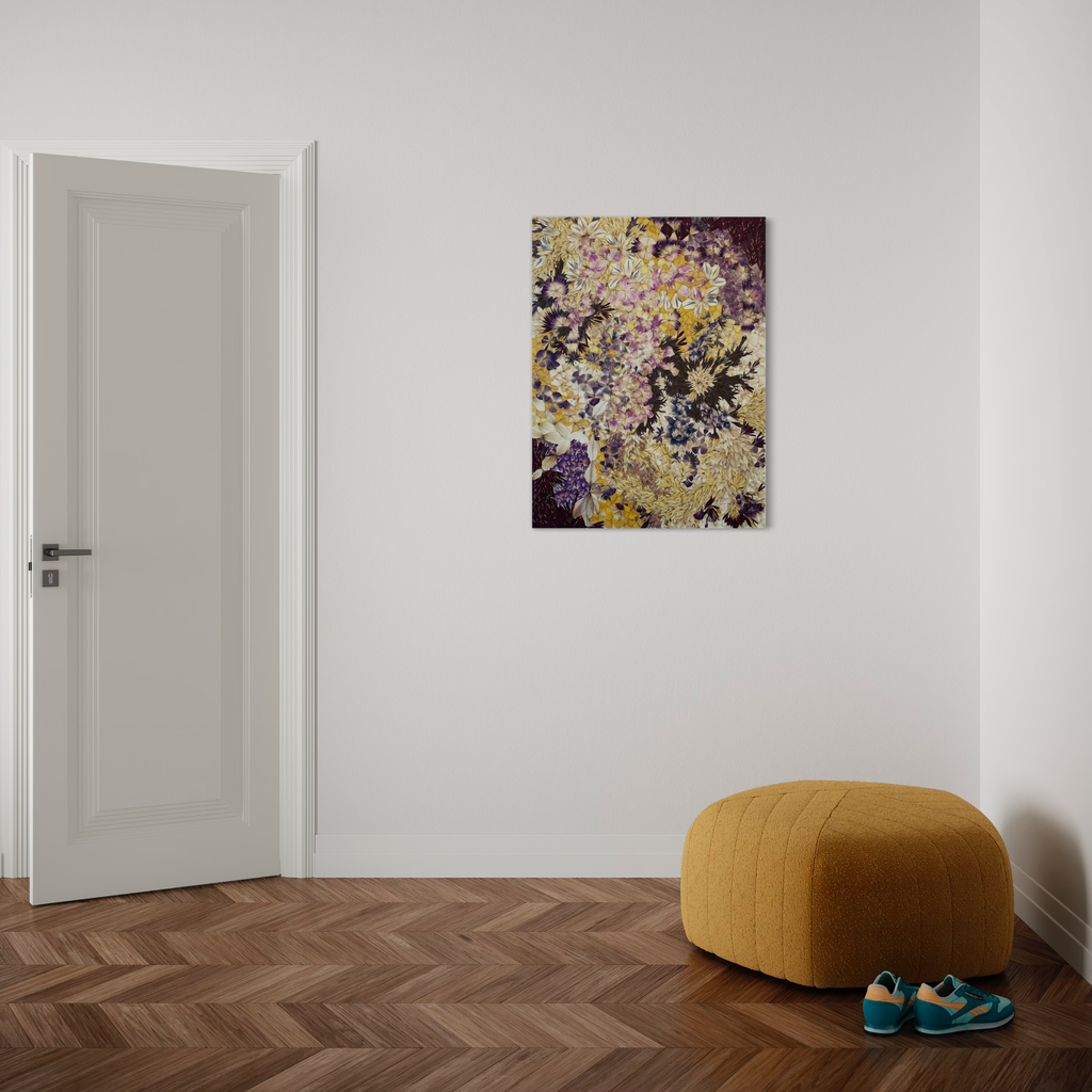 The artwork 'Defloree Self 03' by Valerie Hallier features an abstract composition of preserved flower petals arranged on canvas, creating a dynamic pattern in purple, yellow, and beige tones. The piece, sealed in polyurethane varnish, displays a textural interplay of organic shapes and delicate botanical elements against a dark background, mounted on a minimalist white wall.