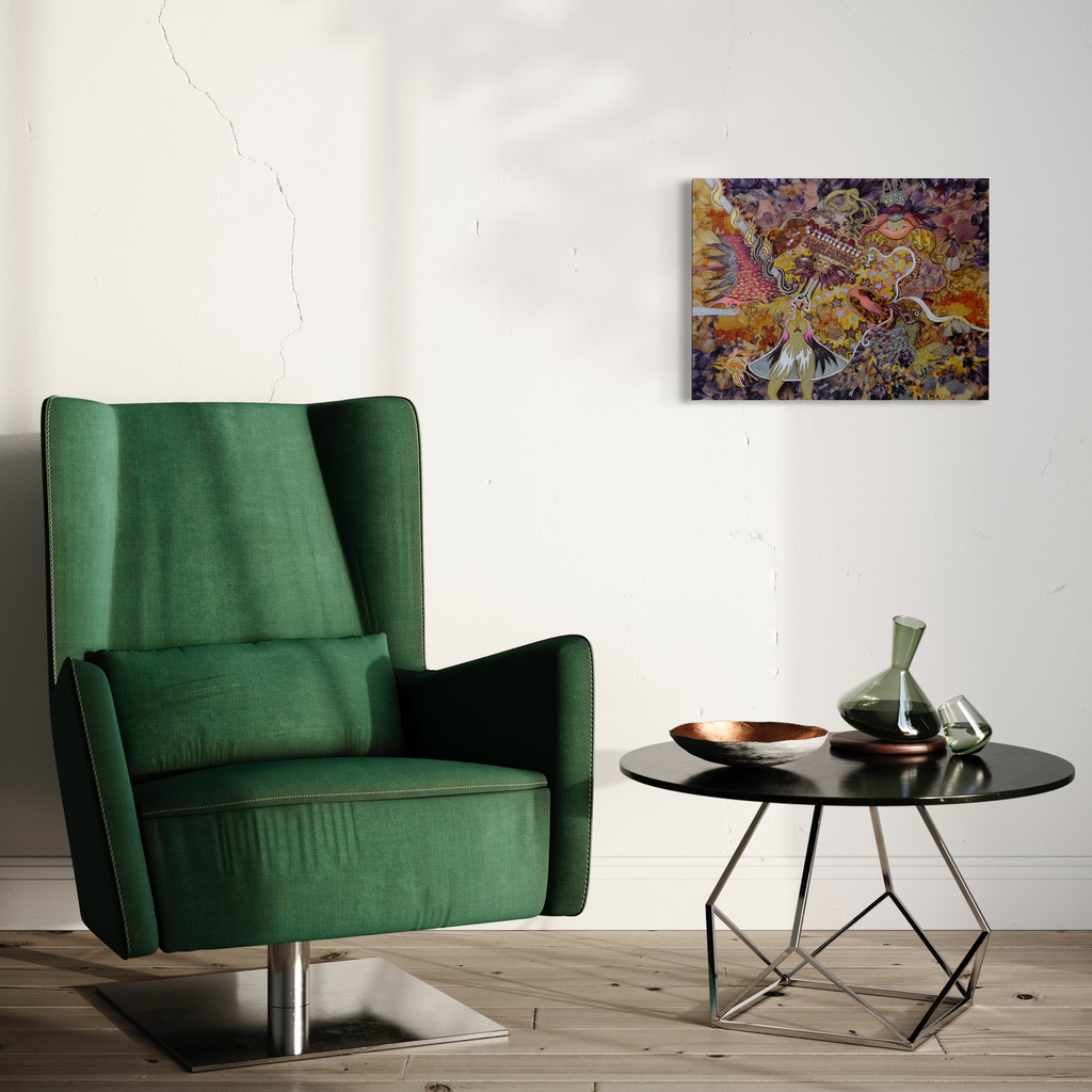 The artwork 'Infinite Drawing Therapy Panel 00' by Valerie Hallier features swirling abstract patterns in vibrant yellows, purples, and orange hues, created with flower petals and mixed media on wood panel. The intricate design suggests organic movement and fluid forms, displayed in a modern interior setting beside a green velvet armchair.