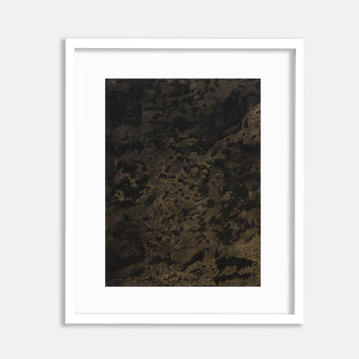 The artwork 'Smudge' by Jacqueline Ferrante features a dark, textural composition with mottled layers of deep brown and black tones. Abstract patterns emerge through the interplay of acrylic, concrete, and charcoal, creating a rich, earthy surface with iridescent highlights. The piece showcases organic, smoky textures reminiscent of weathered stone or mineral formations.
