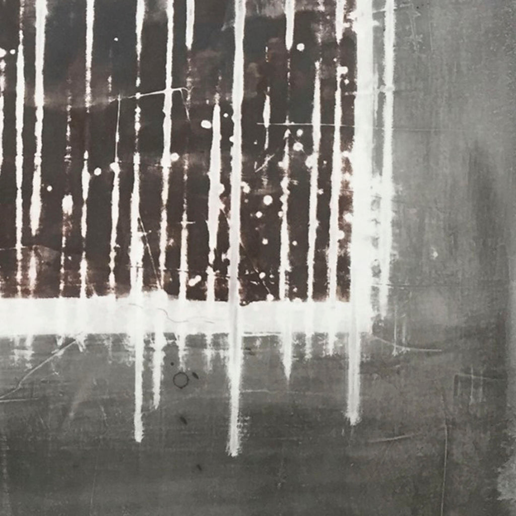 The artwork 'Snowy Window' by Shira Toren features vertical white drips and streaks against a moody gray background, creating an abstract impression of snow falling past a window. The Venetian plaster and graphite on canvas create rich textural contrasts, with stark white lines cutting through darker atmospheric tones, evoking a winter evening's contemplative mood.