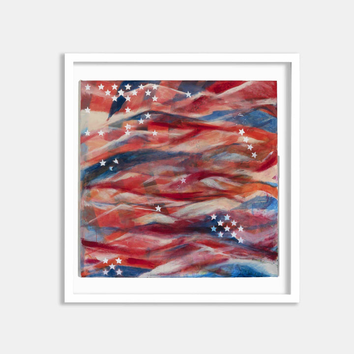 The artwork 'Stars and Stripes' by Camilla Webster features abstract waves of red, white, and blue watercolor strokes reminiscent of the American flag. White stars scatter across the composition, while fluid brushstrokes create dynamic movement throughout the square canvas. Presented in a crisp white frame, this patriotic archival ink print showcases vibrant color blending and ethereal depth.