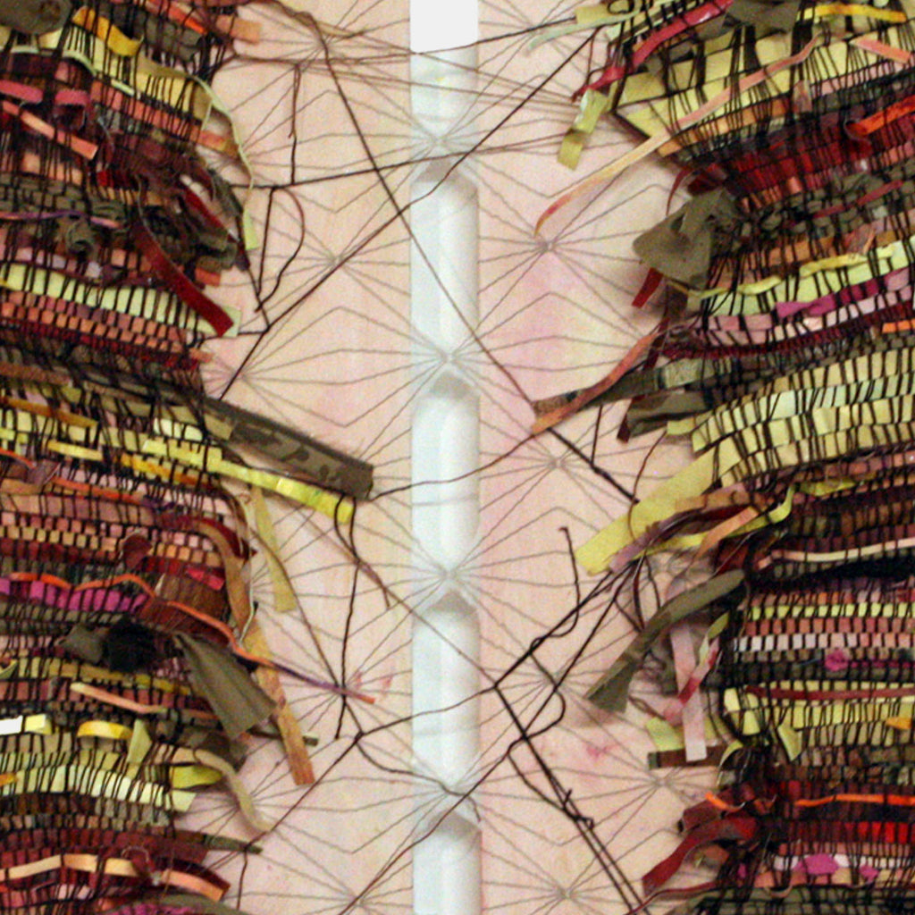 The artwork 'Still Holding On' by Christina Massey features an intricate mixed-media composition with woven textures in red, yellow, and olive tones. A central white vertical band divides the symmetrical piece, while delicate black threads create web-like patterns across the surface. The layered fabric, khakis, and yarn create a dynamic textural interplay.