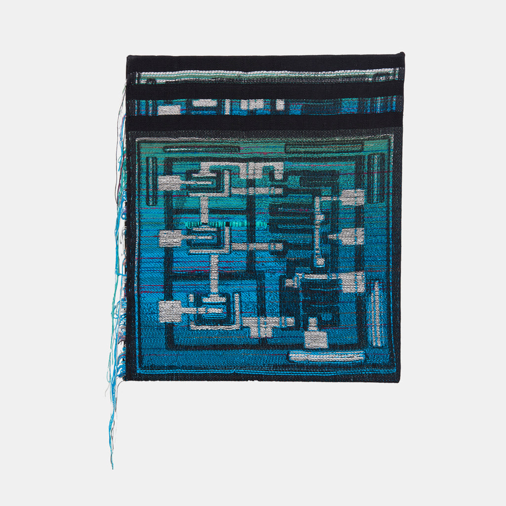 String Circuit by Robin Kang: Abstract textile artwork featuring intricate circuit-like patterns in vibrant turquoise and electric blue, woven with hand jacquard cotton and metallic yarns. Geometric shapes and linear pathways create a tech-inspired maze pattern, enhanced with holographic and silver accents against a black border. Contemporary fiber art merging digital aesthetics with traditional weaving techniques.