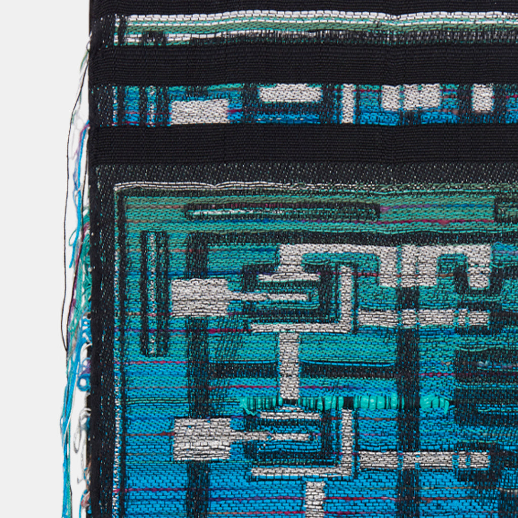 String Circuit by Robin Kang: Abstract woven textile artwork featuring geometric patterns in vibrant turquoise and metallic silver, creating a circuit board-like design. Intricately handwoven using cotton, mohair, silk, and holographic yarns, the piece showcases linear elements and technological motifs against a black background. 20x17.5 inches.
