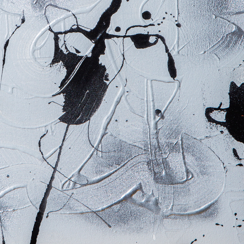 The artwork 'Supernova' by Cavier Coleman features dynamic black splatter patterns against a textured white background, creating abstract fluid movements across the canvas. Bold brushstrokes and drip techniques showcase a monochromatic palette with metallic silver undertones, expressing an energetic contemporary style through mixed media application.