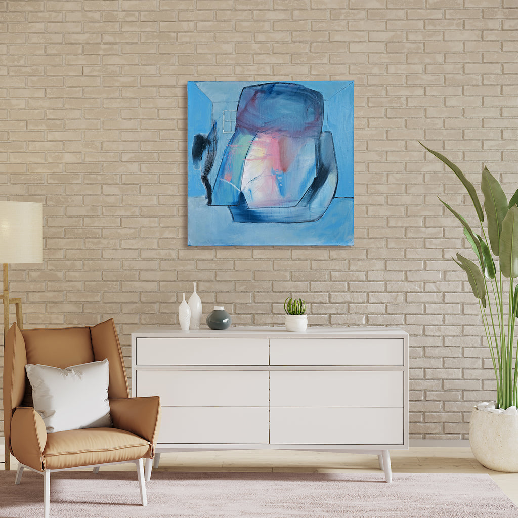 The artwork 'The Shadow Knows' by Gail Winbury features abstract geometric shapes in soft blues and pinks against a serene light blue background. Bold charcoal lines create angular forms, while translucent oil paint layers reveal subtle color transitions. The central form suggests a vessel or container with shadowy elements, rendered in a contemporary expressionist style using oil and charcoal on canvas.