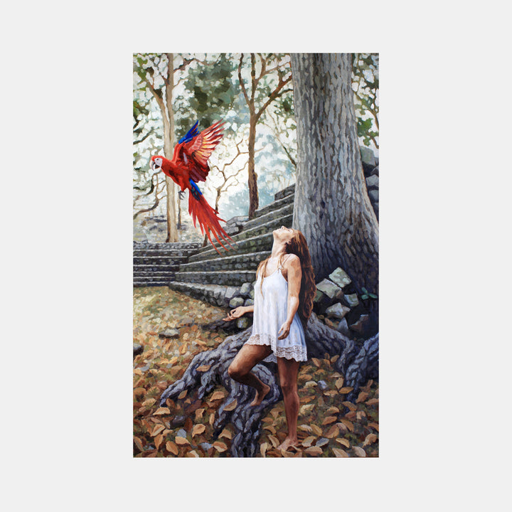 The artwork 'To You From Me' by Elody Gyekis depicts a vibrant red cardinal in mid-flight against a misty forest backdrop with stone steps. A white-dressed figure leans against a large tree trunk amid fallen autumn leaves. The oil painting features ethereal natural lighting and soft brushwork, creating a dreamy woodland atmosphere on a 60x36 inch canvas. By Elody Gyekis.