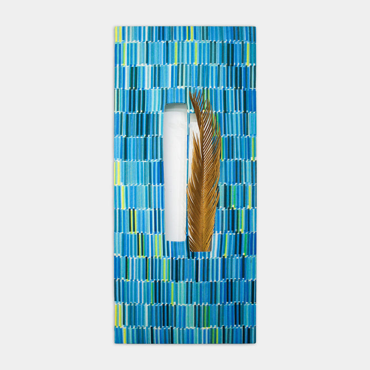 The artwork 'Composite 21' by Molly Koehn features a vertical geometric pattern of turquoise and aqua blue rectangles screen printed on raw silk, with a preserved golden brown dried plant element centered in a white negative space, creating a striking contrast between organic and geometric forms. 40x18 inches.