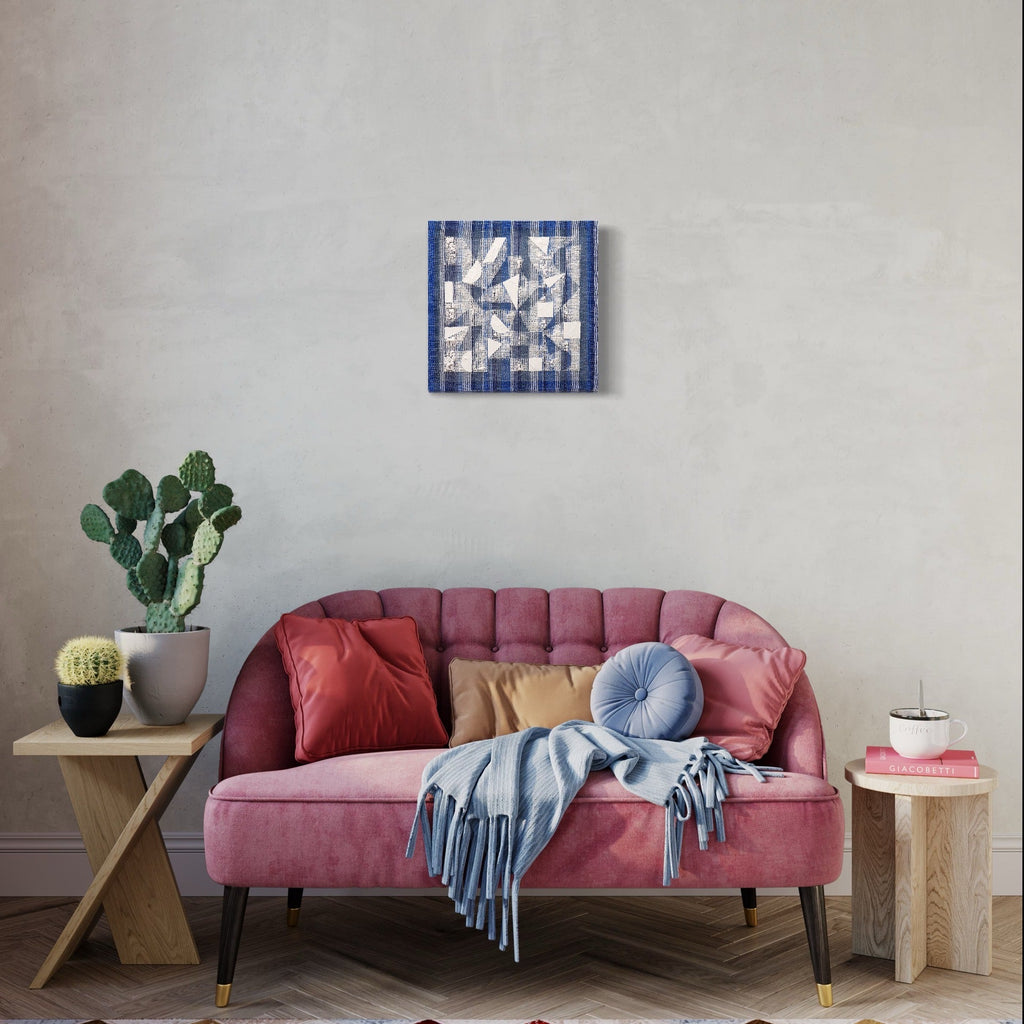 Stripe Shape by Morgan Hale: Abstract geometric wall art featuring interwoven white and navy blue stripes creating a dynamic pattern. Handcrafted using linen and plaster, the 15x15 inch piece showcases clean lines and modern minimalist design. Textural elements blend seamlessly, offering visual depth and architectural appeal.
