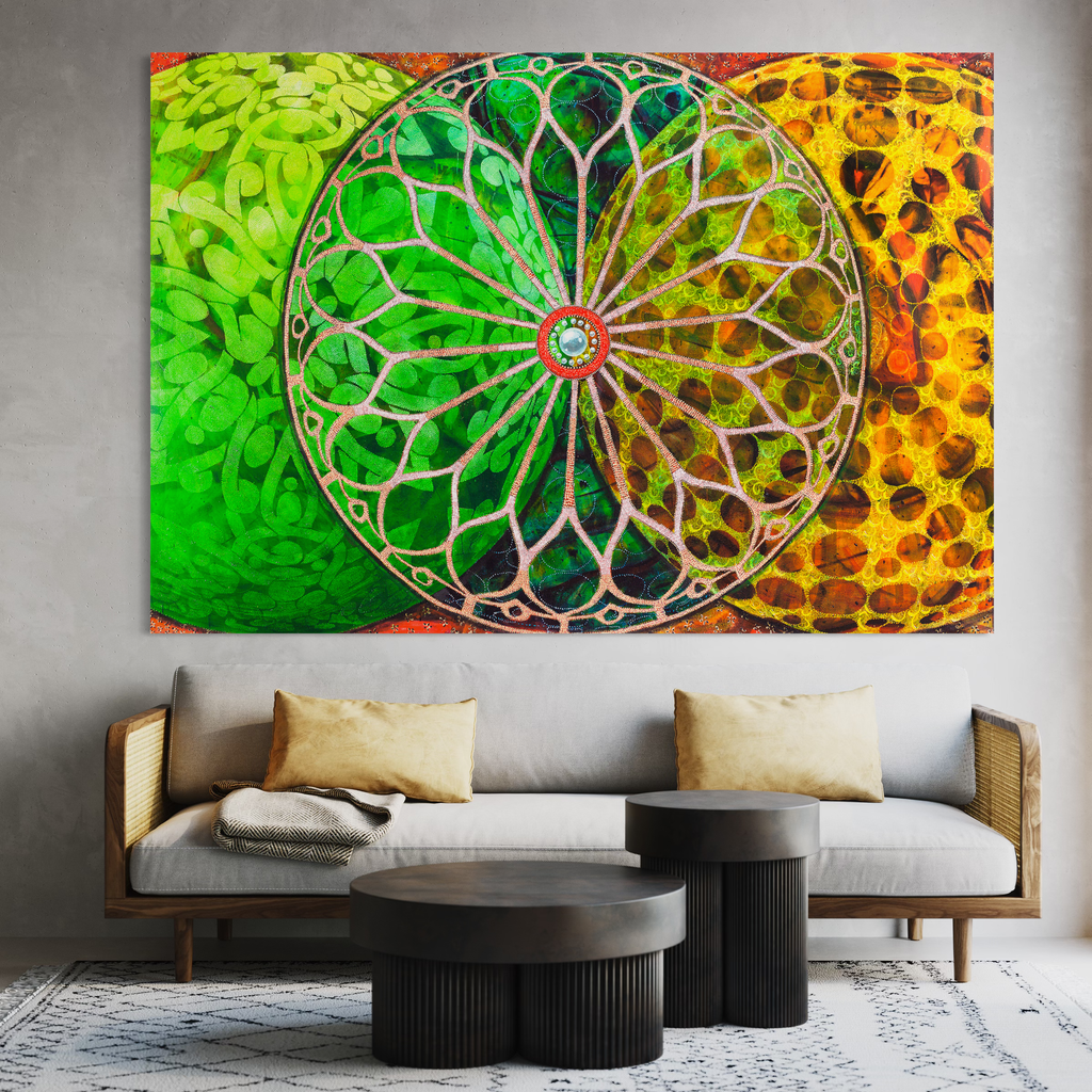 The artwork 'Abba Abba' by Amy Cheng features a striking mandala-like circular design with intricate silver filigree patterns radiating from a central point. The background transitions from vibrant lime green to rich amber orange, creating a dynamic color gradient. The detailed metallic rose window pattern combines geometric precision with ornate floral elements in an oil on canvas measuring 62 by 90 inches.