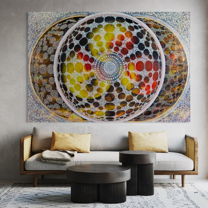 The artwork 'Squaring the Circle' by Amy Cheng features a mesmerizing circular mandala design with concentric patterns of vibrant dots in yellow, red, orange, and black. White circular rings frame the kaleidoscopic composition, creating depth against a shimmering silver background. This large-scale oil painting demonstrates geometric precision and radial symmetry, measuring 62x90 inches.