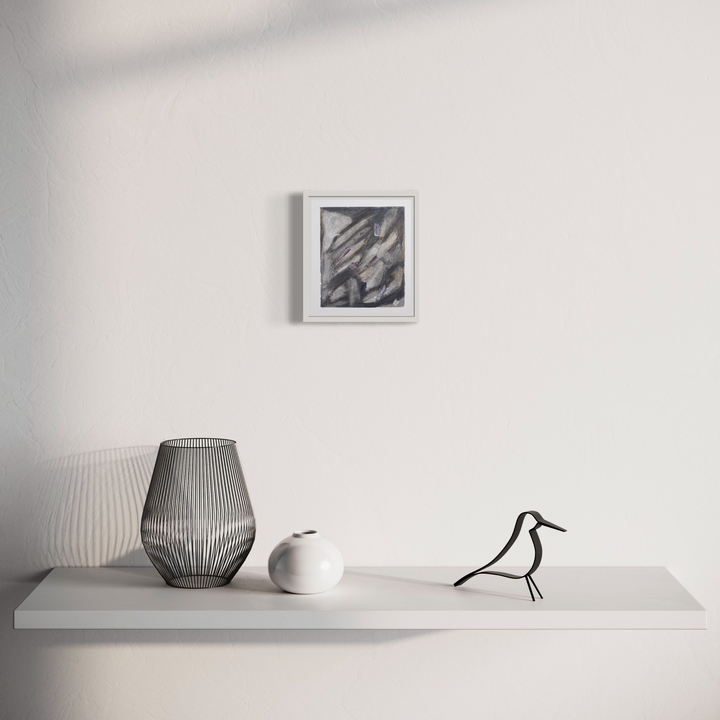 The artwork 'Cagliari (3)' by Diana Naccarato features an abstract pencil drawing with dynamic diagonal strokes in grayscale, displayed in a white frame alongside a modern vignette showing a minimalist shelf with decorative objects including a wire bird sculpture, geometric vases in white and gray tones.