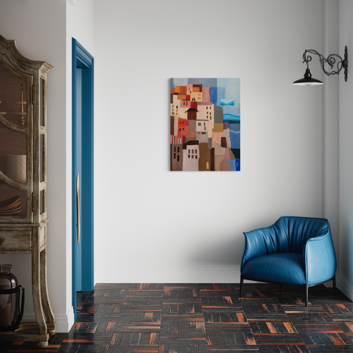 The artwork 'Cinque Terre' by Chelsie Sunde depicts a vibrant Mediterranean coastal village with stacked cubic buildings in warm terracotta, peach, and cream tones against a blue sea backdrop. The oil painting showcases geometric architectural forms in a modernist style, capturing the iconic Italian seaside aesthetic on a 40x30 inch canvas.