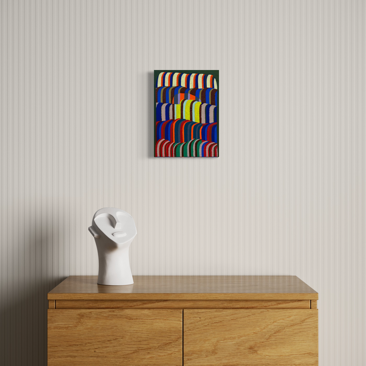 The artwork 'Hidden Arch' by Natalie Lanese features vibrant curved stripes in red, blue, yellow, and green arranged in a rhythmic pattern creating an optical illusion of depth and movement. The bold geometric composition on panel combines Flashe, acrylic, oil, and pumice for rich textural elements against a dark background, measuring 12x9 inches - by Natalie Lanese.