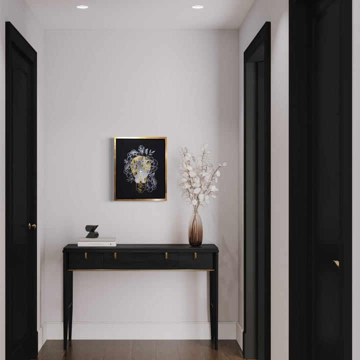 Inspire Me - Gold & Silver Edition by IvIvI: Abstract floral artwork featuring metallic gold and silver elements on a black acrylic background, displayed in a minimalist hallway setting above a sleek black console table. Contemporary artwork showcases intricate botanical details on gessobord with wooden frame, styled with white dried florals in vase.