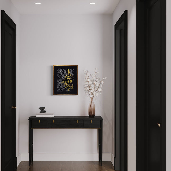 The artwork 'Its Me In The Mask - Gold & Silver Edition' by IvIvI features intricate golden and silver spiraling designs on a black acrylic background, displayed in a modern hallway setting against a white wall, showcasing abstract mask-like patterns in metallic finishes on gessobord with wooden frame, mounted above a sleek black console table. By IvIvI.