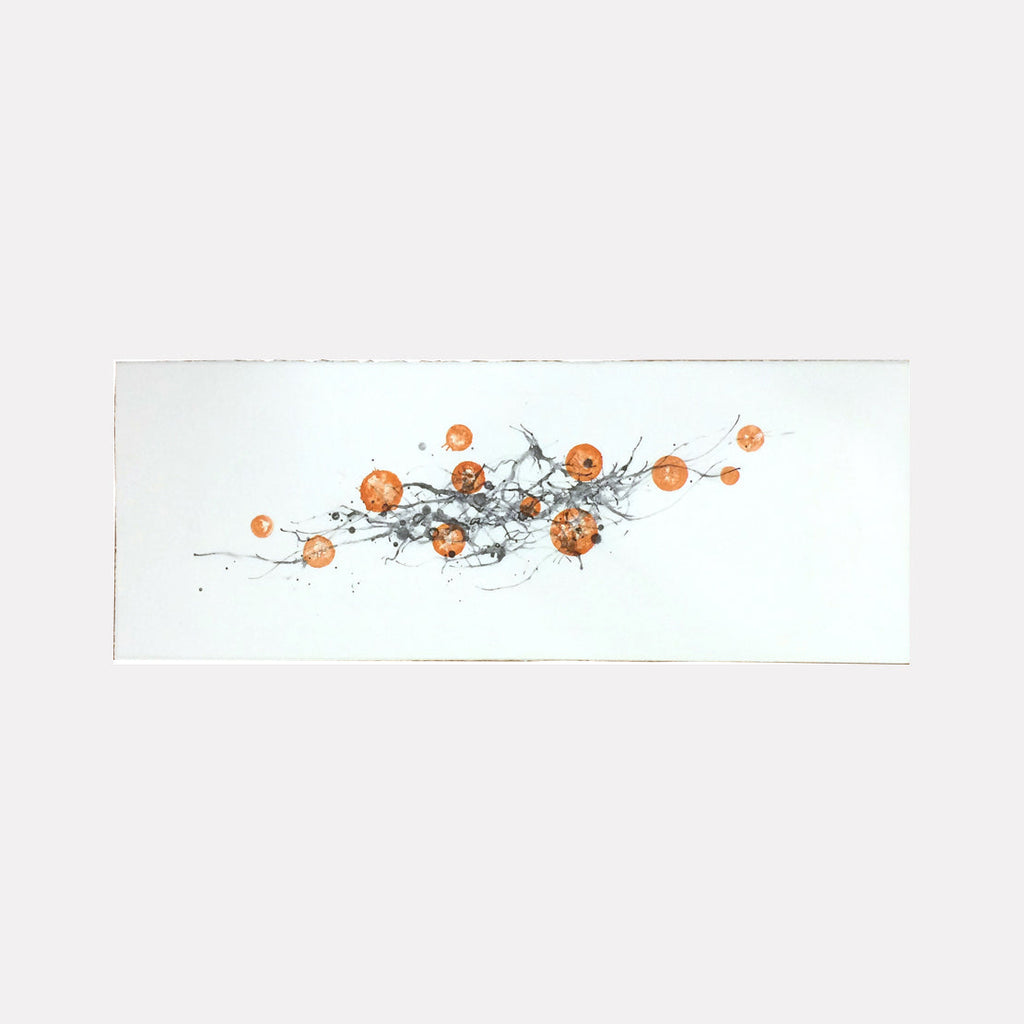 The artwork 'Milky Way (Orange)' features delicate gray brushstrokes intertwined with vibrant orange circular forms scattered across a pristine white background. The lithographic print creates a dynamic, celestial-like composition suggesting movement and cosmic harmony through minimalist design by Sonomi Kobayashi.