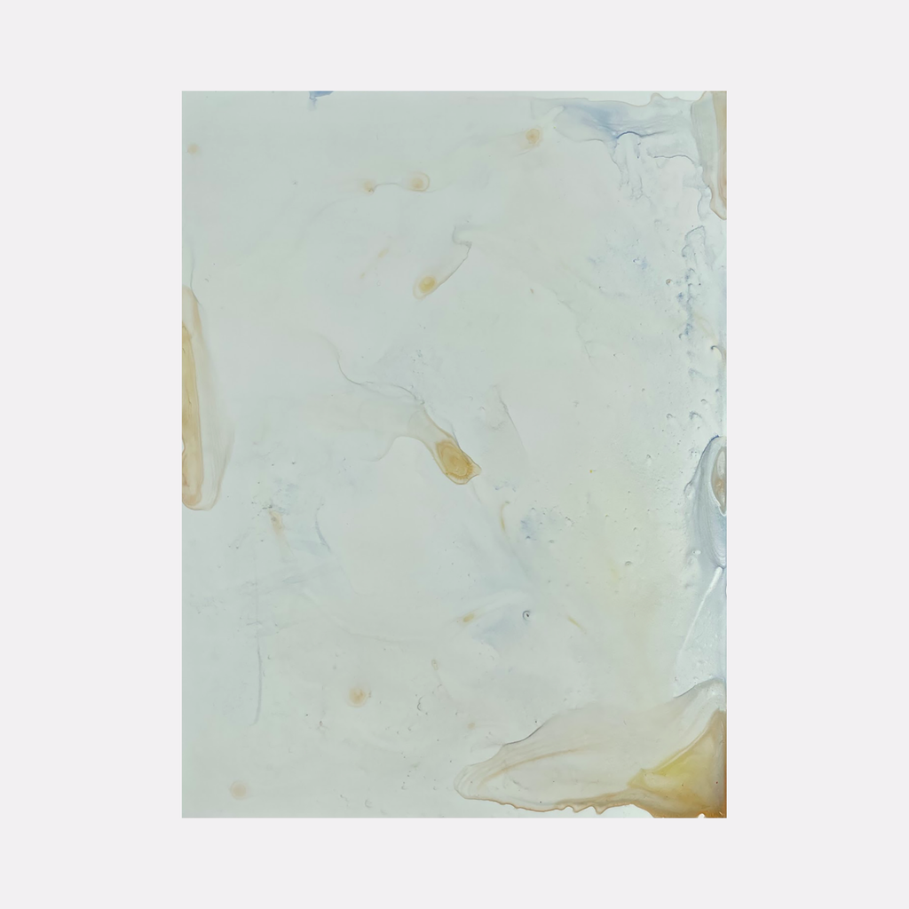 The artwork 'Re.lease #32' by Dina AZ Salem features ethereal acrylic washes on yupo paper, creating a minimalist abstract composition in soft mint green and pale golden hues. Delicate organic forms float across the surface, with translucent layers and subtle color transitions characteristic of fluid painting techniques.