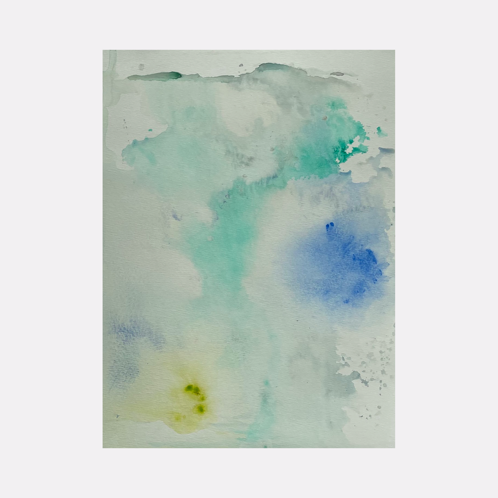 The artwork 'Re.lease #33' by Dina AZ Salem features ethereal watercolor-like effects in acrylic on paper, with delicate washes of turquoise, soft blue, and subtle yellow tones blending into a misty white background. The abstract composition creates a dreamy, atmospheric effect with floating color formations suggesting clouds or underwater scenes.