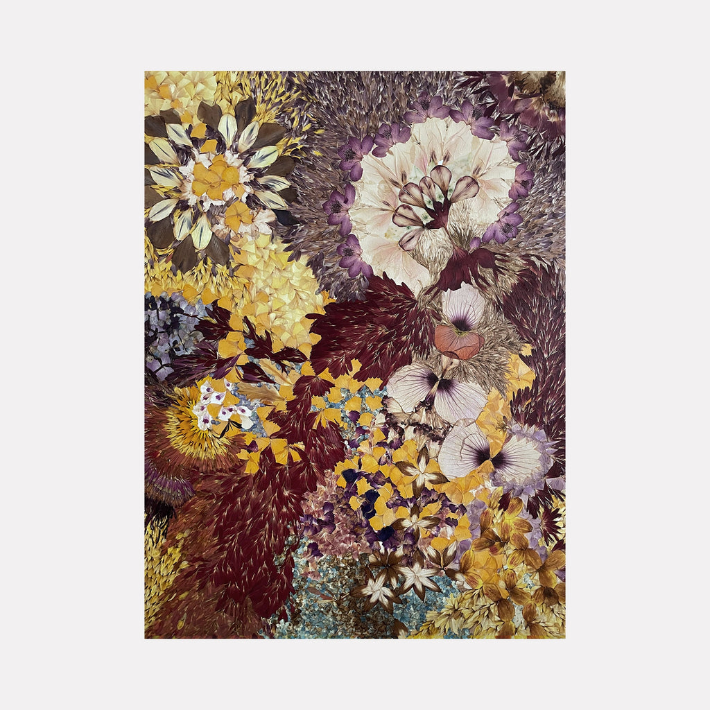 The artwork 'Defloree Self 05' by Valerie Hallier features a vibrant collage of pressed flower petals arranged in a dynamic composition. Rich burgundy, golden yellow, and ivory blooms create an ethereal floral burst pattern. The preserved petals, sealed in polyurethane varnish on canvas, form intricate circular patterns resembling celestial bodies, showcasing both delicate textures and bold organic shapes.