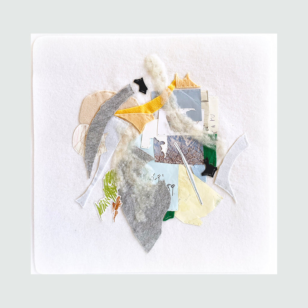 The artwork 'Mountain' by Linden Eller features an abstract collage composition with geometric paper fragments in soft grays, yellows, and whites, hand-sewn onto white felt. Angular shapes suggest mountainous terrain, while delicate stitching adds texture and dimension. Touches of green and transparent layers create depth in this contemporary mixed-media piece.