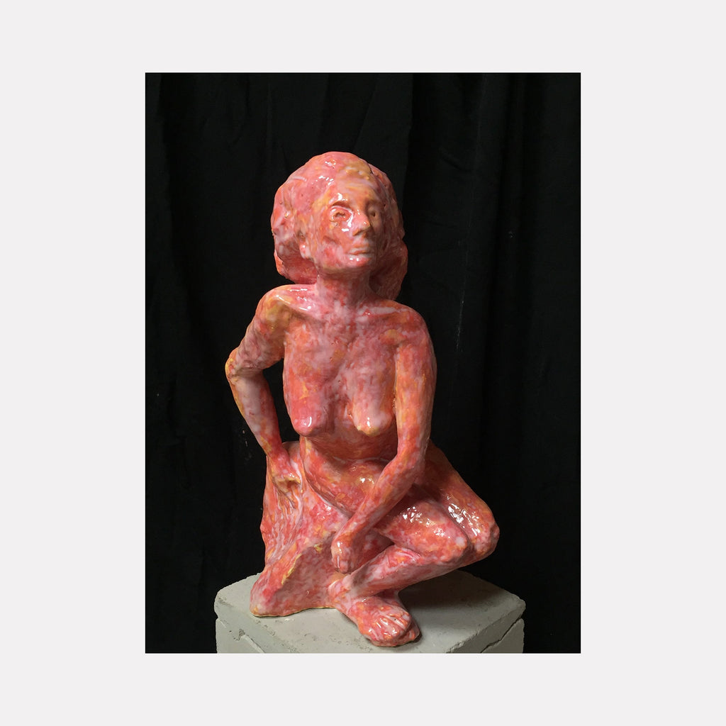 The artwork 'Seated Queen' by Mark LaRiviere features a coral-pink glazed ceramic sculpture depicting a figure in a contemplative pose. The textured surface captures light and shadow, creating a dynamic interplay across the form. The figure is positioned in a relaxed seated posture, measuring 12.5 inches tall. The piece showcases expressive modeling techniques and a vibrant monochromatic glaze treatment.