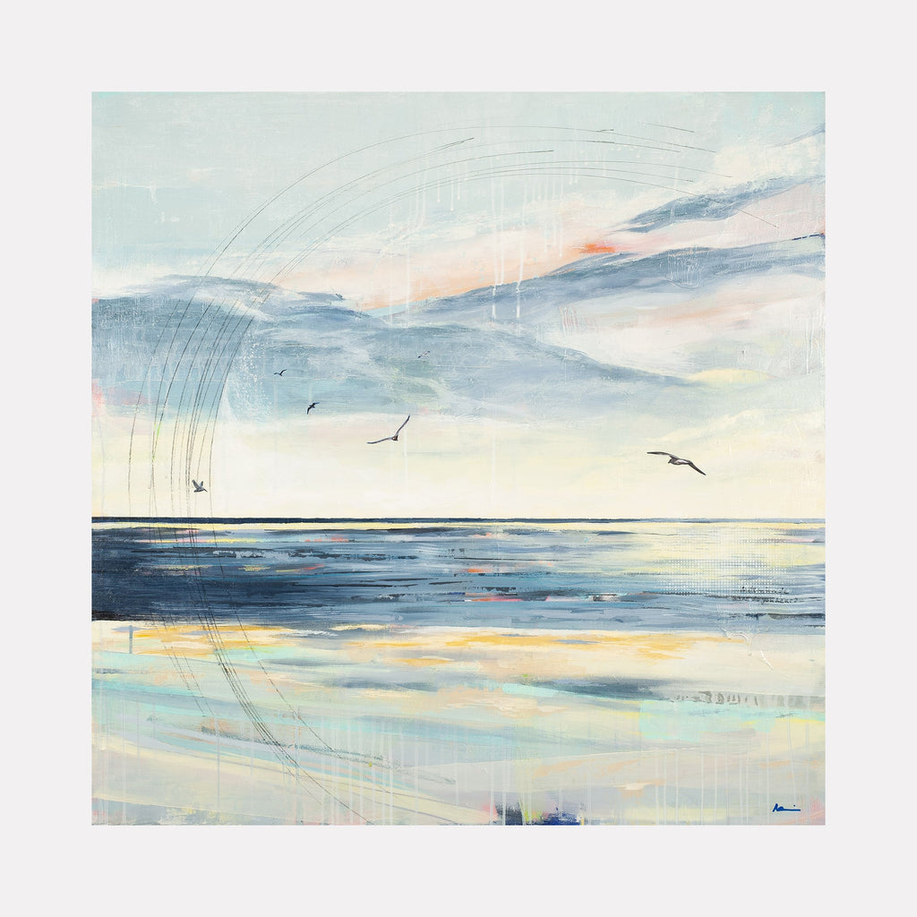 The artwork 'Serenity' by Nicki Adani captures a tranquil seascape with soaring seabirds against a pastel sky. Soft blues and gentle yellows blend in the horizon, while delicate brushstrokes create rain-like textures falling from ethereal clouds. The ocean reflects golden light, creating a peaceful mixed media composition on wood panel that evokes coastal calm.