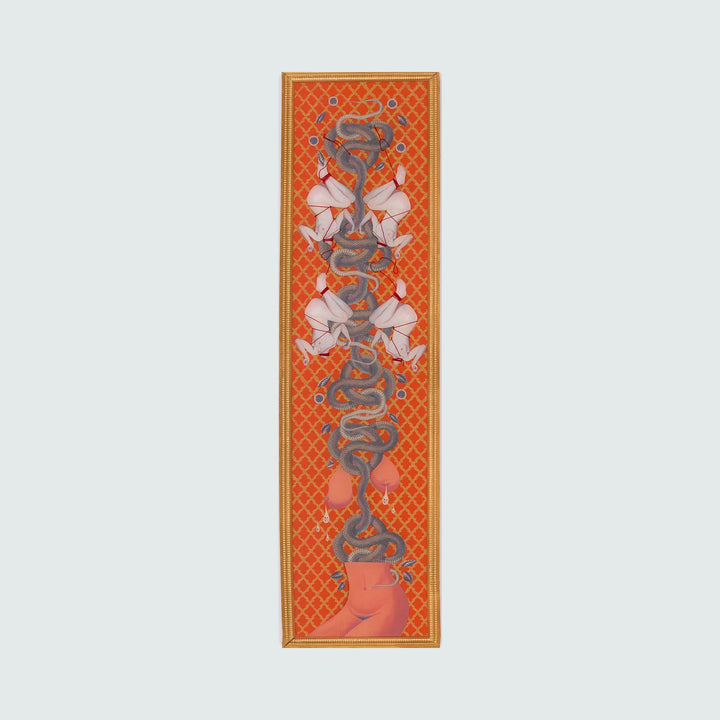 Snake Couture Red Embellished by Chelsea Amato features a striking vertical mixed media collage with repeating motifs of sinuous blue serpents intertwined with white floral elements against a vibrant orange-red latticed background. The ornate composition measures 16x60 inches and is framed in golden borders, showcasing a harmonious blend of Eastern and contemporary design elements.