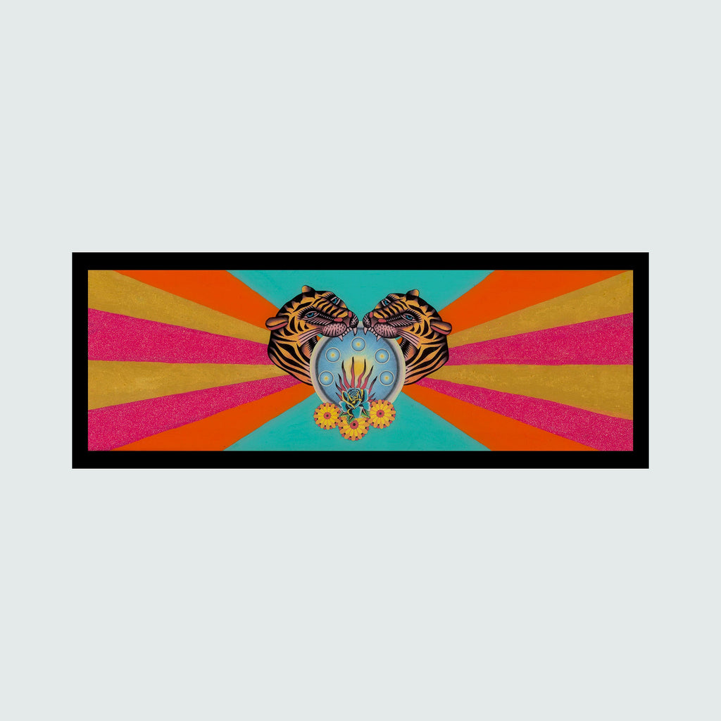 The artwork 'Tigers' by Chelsea Amato features a symmetrical mixed media collage with two mirrored tiger heads flanking a central turquoise orb against a vibrant sunburst background of orange, yellow, and pink rays. The orb contains mystical floral elements, creating a psychedelic retro aesthetic in a horizontal panoramic format.