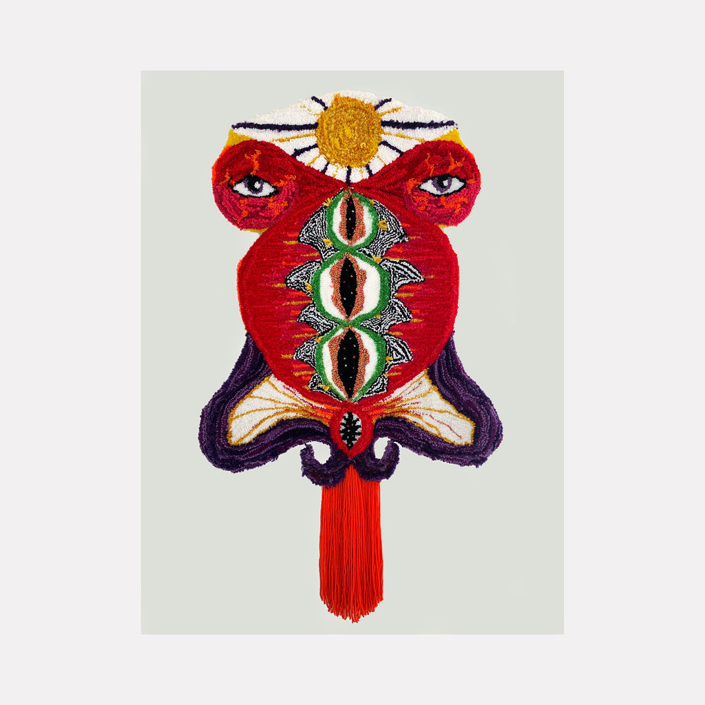 The artwork 'histerica #7, Baubo' by Ana Maria Farina features a vibrant textile composition with red, green, and gold fibers on monk's cloth. A striking design shows abstract shapes with three circular motifs in green and cream, topped by a golden sun-like element. The piece incorporates rich textures through upcycled fibers, creating a bold, symmetrical pattern with deep purple curved elements at the base.