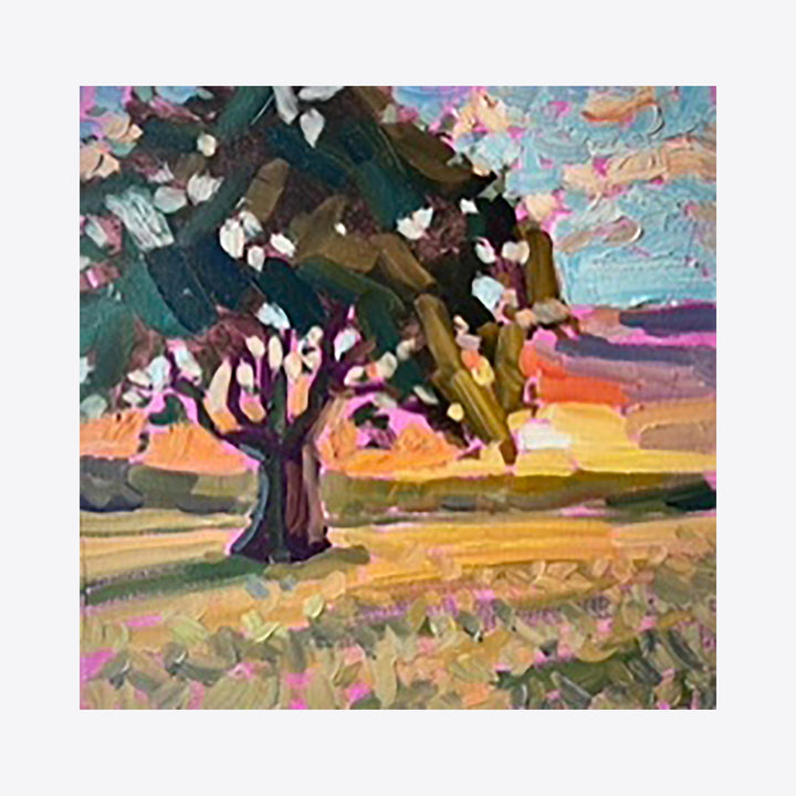 The artwork 'The Lone Tree' captures a solitary tree with white blossoms against a vibrant sunset sky. Impressionistic brushstrokes create a textured landscape with warm orange and pink hues in the background, while the foreground features violet and green wildflowers. The oil painting demonstrates expressive impasto technique on 12x12 canvas by Elody Gyekis.