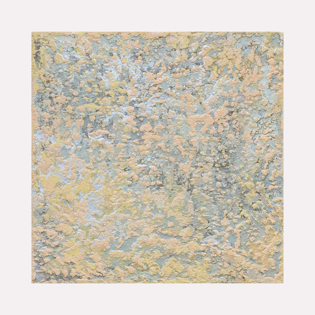 The artwork 'Sediment II' by Jacqueline Ferrante features a textured abstract composition with layered acrylic and iridescent pigments in soft blue and golden hues, creating a marbled, geological-like pattern reminiscent of natural sedimentary formations on a birch panel. The interplay of colors and textures suggests movement and depth across the 10x10 inch surface.