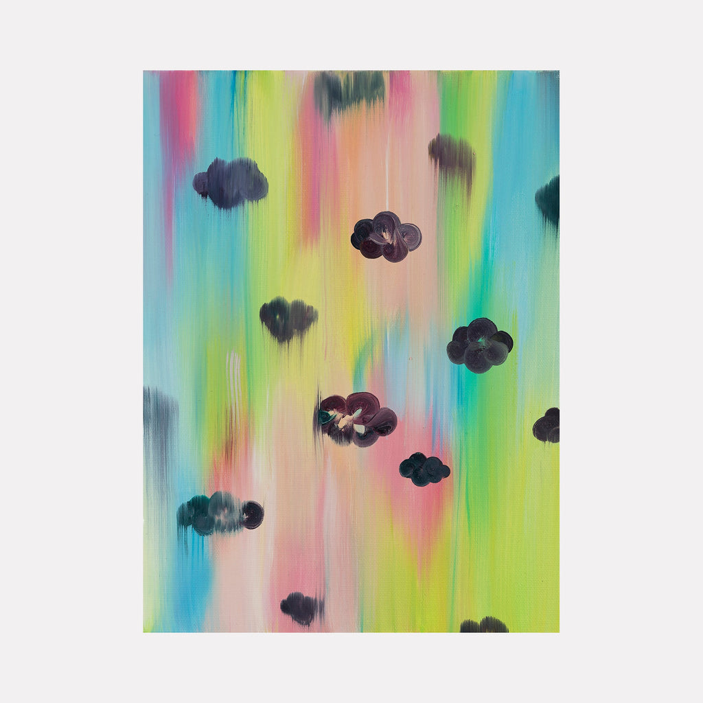 The artwork 'Excuse Me While I Kiss The Sky II' features dark cloud formations floating against a vibrant rainbow-colored background with vertical brushstrokes. The pastel blues, pinks, and yellows create a dreamy atmosphere, while black cloud shapes add contrast to the ethereal backdrop. Oil on canvas painting by Ketta Ioannidou.