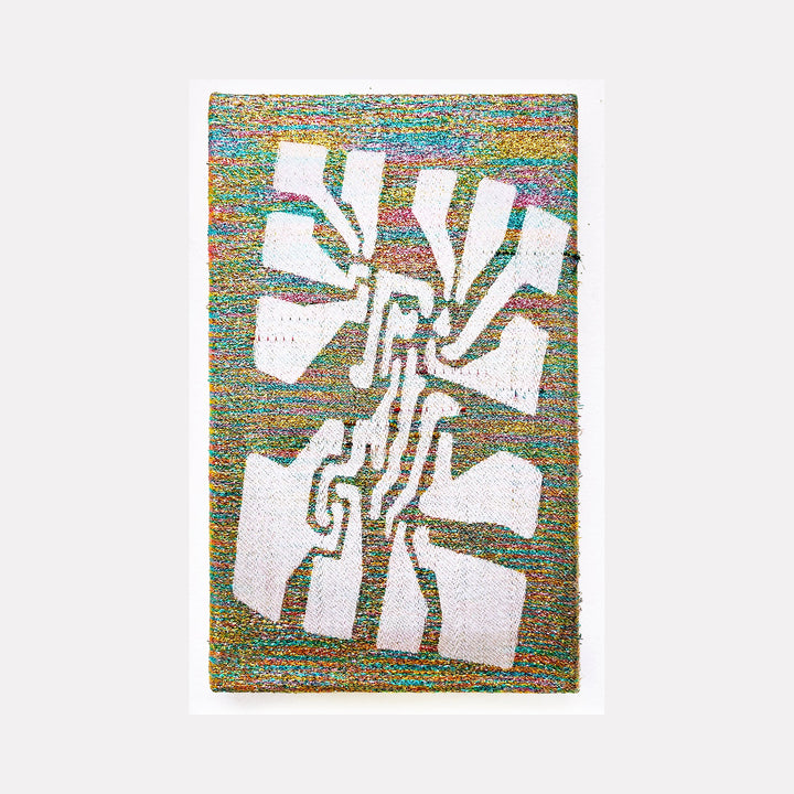 The artwork 'Harmonic Flower' by Robin Kang features an abstract geometric design with white angular shapes resembling petals arranged in a dynamic spiral pattern. Handwoven with iridescent metallic yarn and cotton, the composition displays a vibrant background of interwoven turquoise, gold, and rainbow hues, creating a striking contrast against the clean white forms.