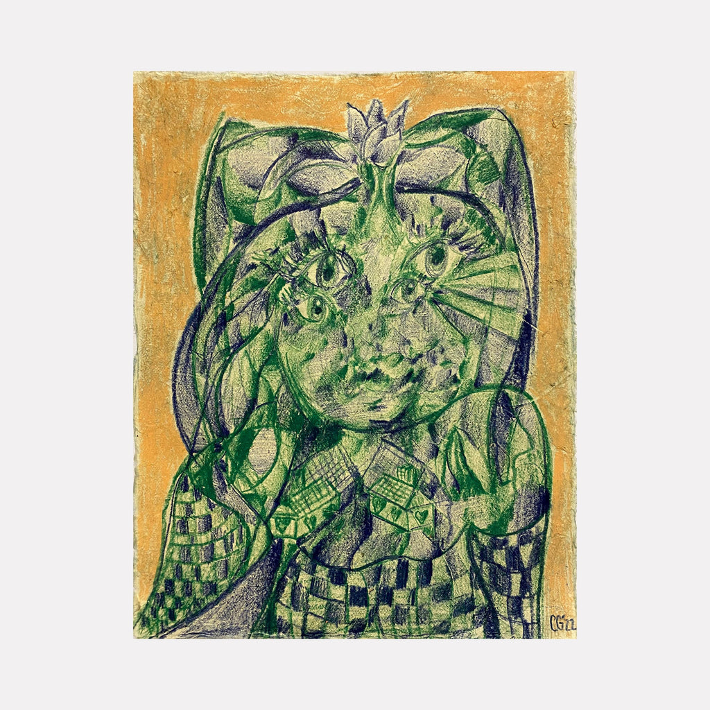 The artwork 'Heart and Home' by Chancy Glance features a mystical cat-like figure rendered in vibrant green colored pencil on lokta paper. The subject bears an intricate checkered pattern body against a warm golden background, with ethereal details and flowing lines creating a dreamlike quality. The distinctive style blends geometric patterns with organic shapes.