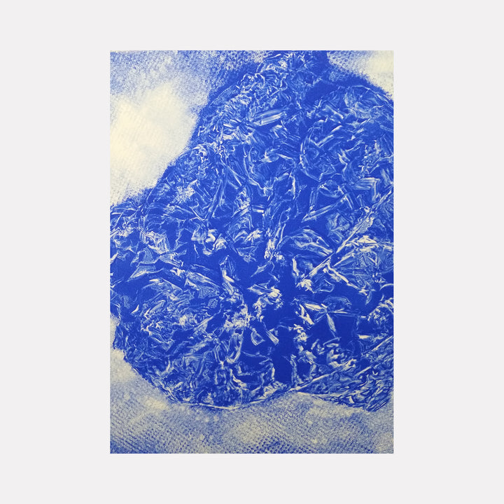 The artwork 'Crater Lake' by Johanna Ryan features an abstract composition of vibrant cobalt blue forms against a textured white background, created using gelatin print technique on paper. The central blue mass suggests a topographical view, with intricate crystalline patterns and dynamic textures resembling water ripples or geological formations.