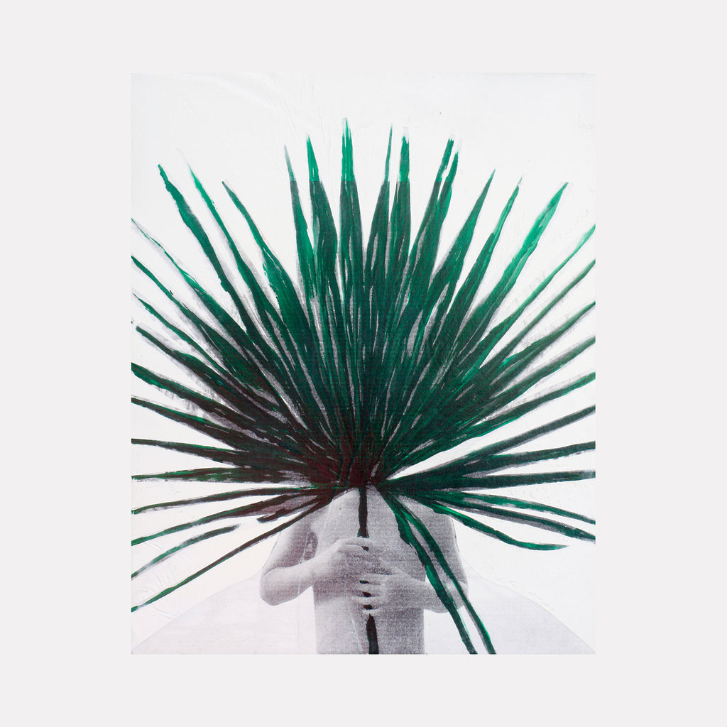 The artwork 'Palm Child' by Aaron Hillebrand features a striking composition of vibrant emerald palm fronds radiating outward against a white background, created through acrylic and photo transfer on wood panel. The palm leaves create a dramatic fan-like burst effect, emerging from a minimalist grayscale figure base.