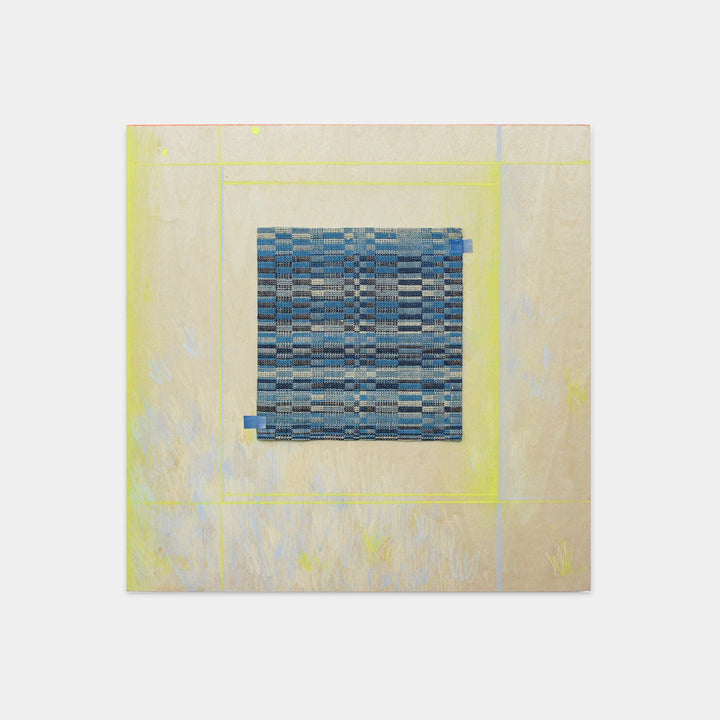 The artwork 'Reflector 3' by Molly Koehn features a geometric pattern of handwoven blue and gray textiles centered on a cream-colored panel with subtle yellow borders. The intricate weaving combines stainless steel, linen, silk, and nylon, creating a mesmerizing checkerboard pattern with varied shades of blue. Colored pencil details enhance the composition.